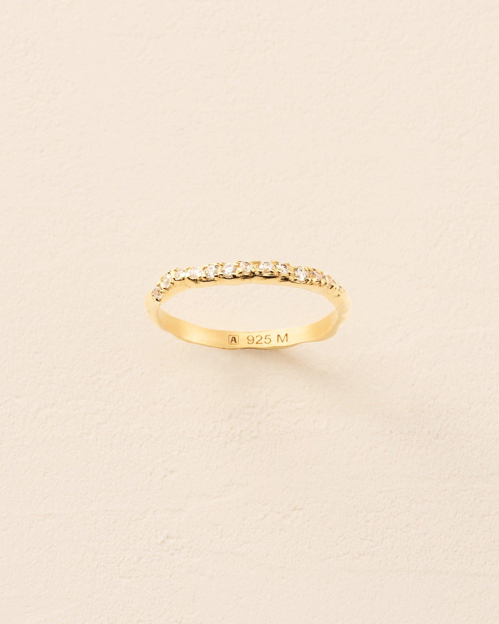 Clara Ring: Gold band with small, irregularly claw-set stones.