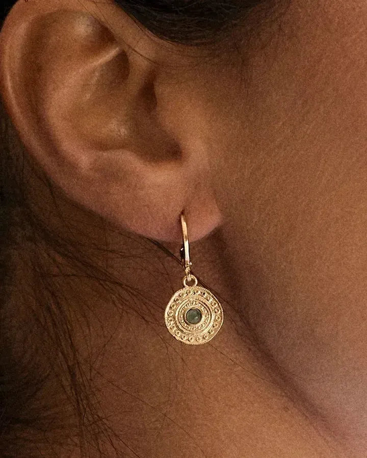 Alba green earrings: gold-toned, round, ornate Persian design with a central lush green stone.