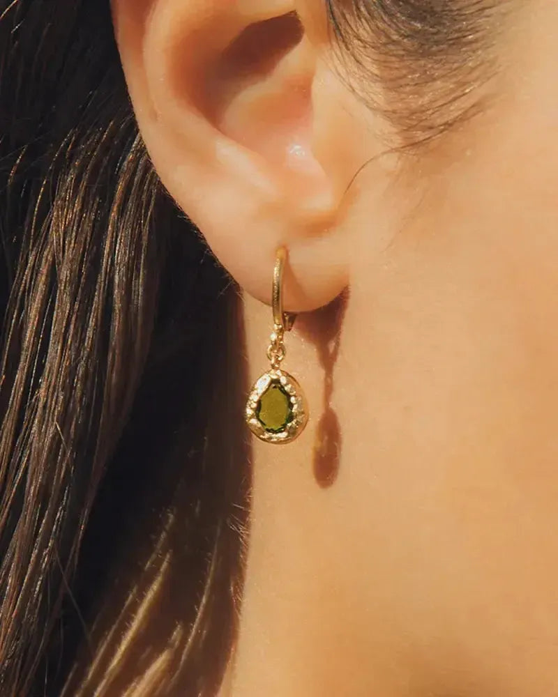 Lysia dark green teardrop stone earrings on small gold hoops, hand-set in textured gold.