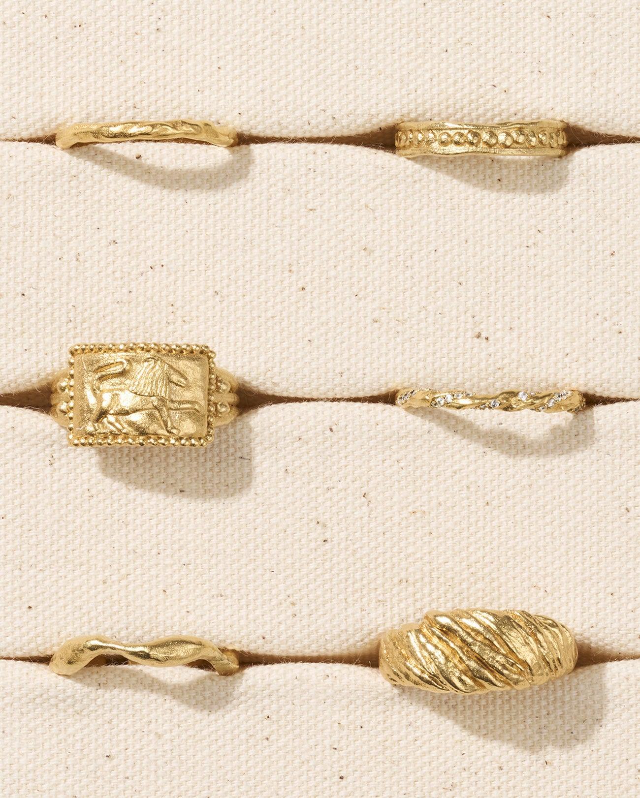 Dainty, hammered gold Nina ring with textured, elegant finish, perfect for stacking.