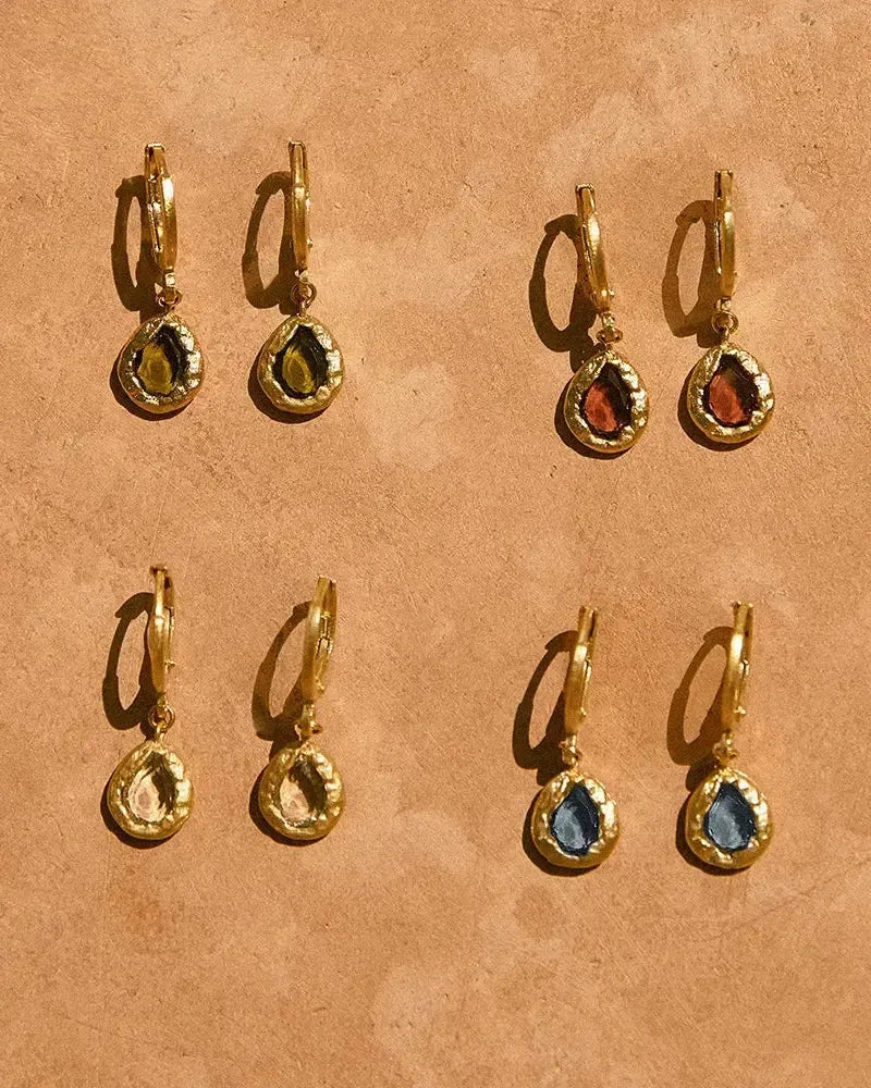 Lysia rosewood earrings: gold hoops with textured gold drop pendants, each featuring a hand-set rosewood stone.