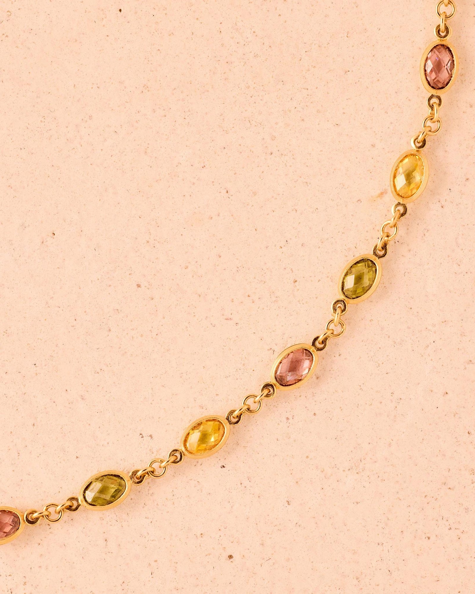Fruitera Autumna gold chain necklace with alternating rosewood, golden yellow, and dark green stones.