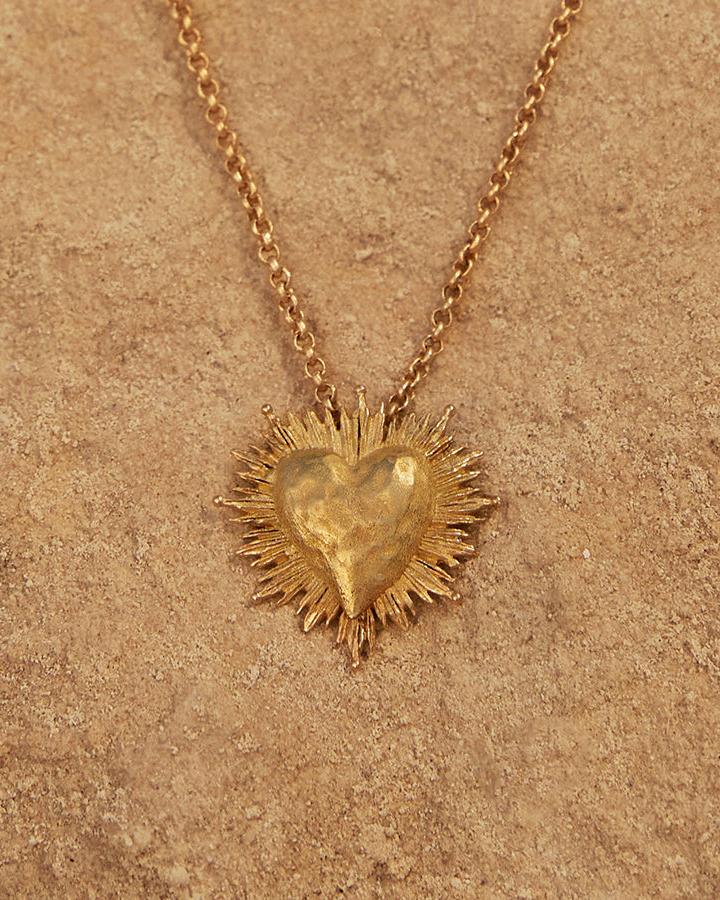 Gold Amada Necklace with hammered heart pendant and intricate sunburst design.