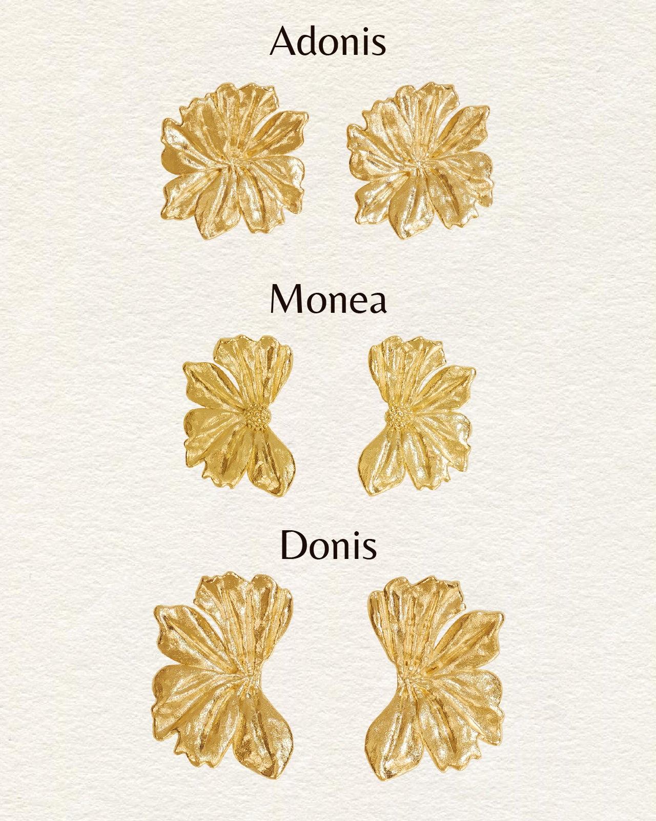 Pair of large, gold, flower-shaped Donis earrings with delicately engraved petals.