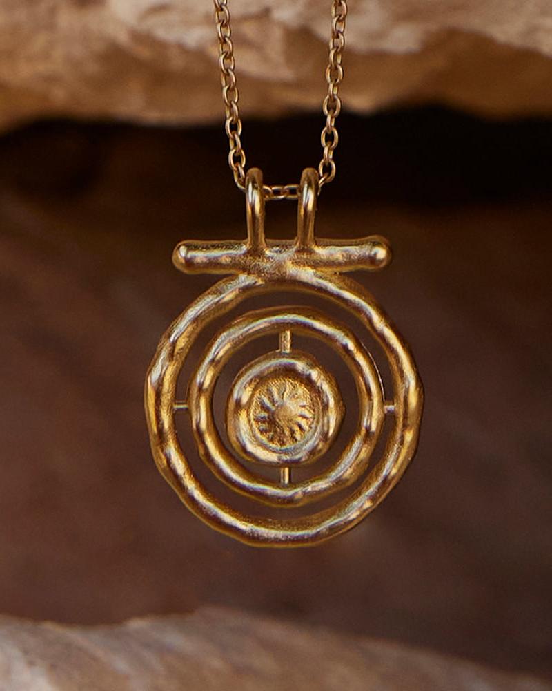 Gali Necklace: Golden astrolabe-inspired pendant with spinning sun design on a delicate chain.