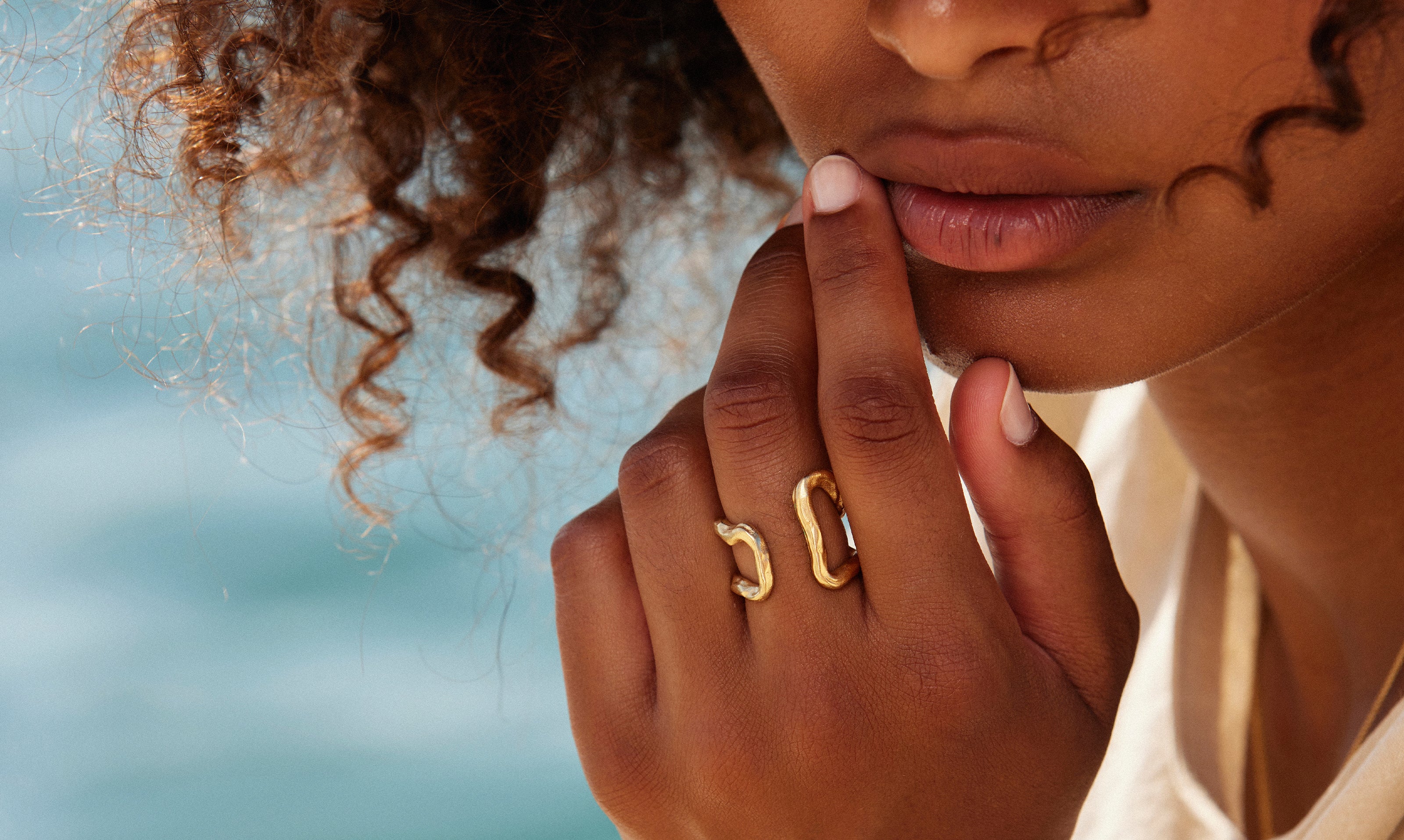 Gold-plated Anora ring being worn